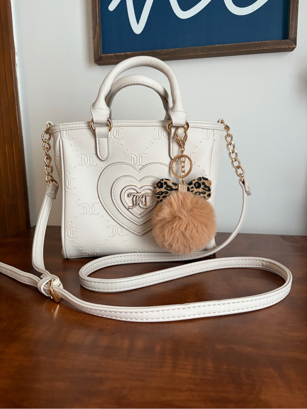 Juicy Couture Cream Heart-Embossed Satchel with Pom-Pom Charm
